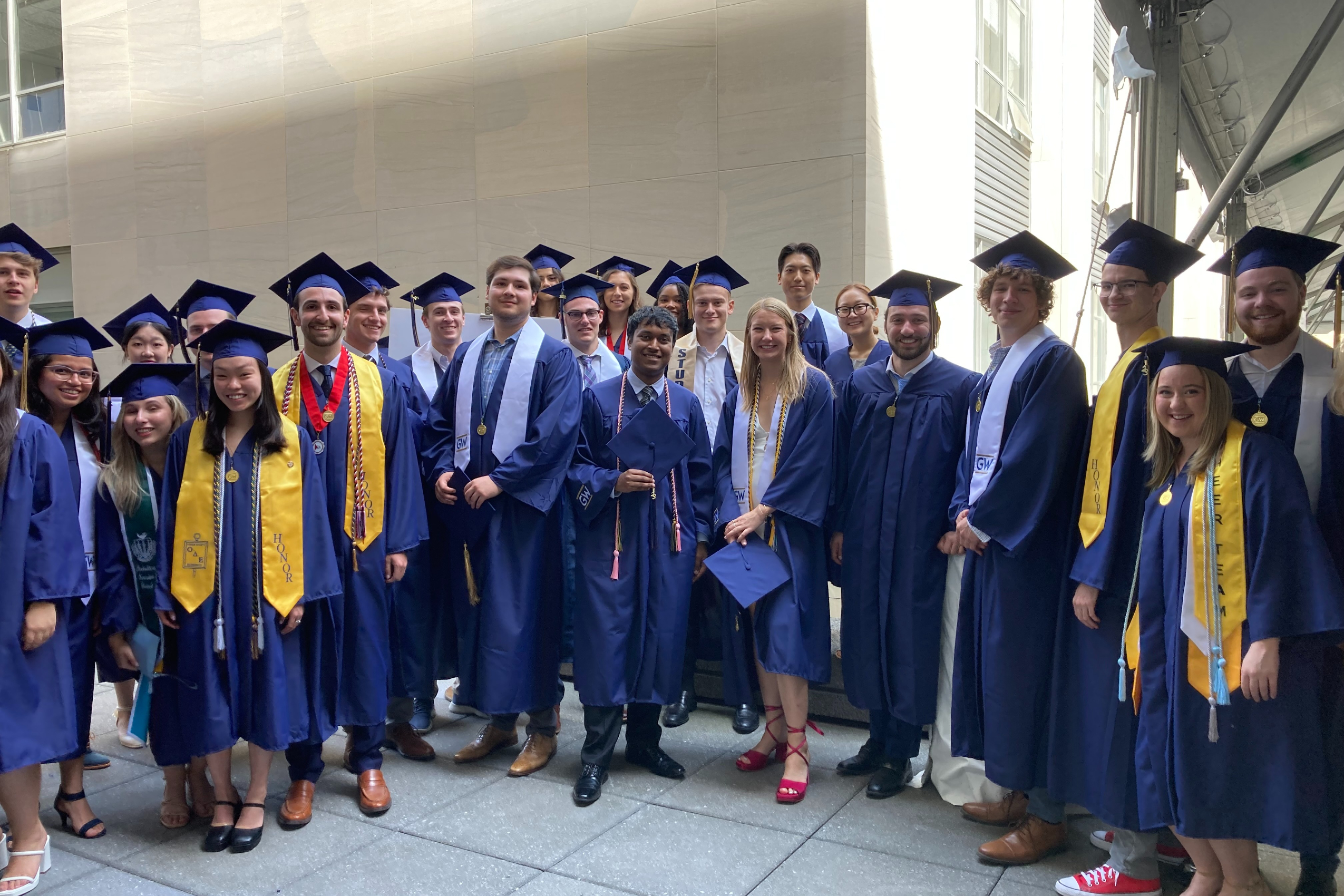 undergrads in cap and gown