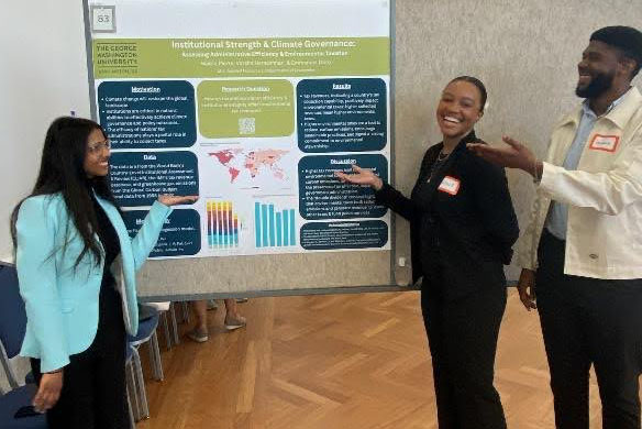 MS in Applied Economics students Varsh Narasimhan, Naissa Pierre and Emanuel Obro presenting their research on institutional strength and climate governance