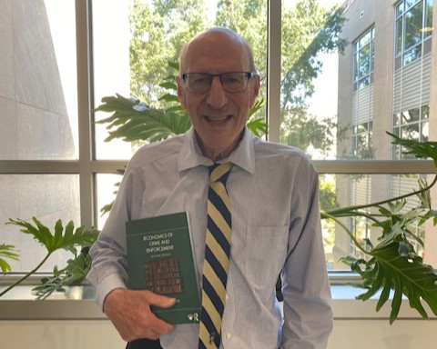 professor yezer with his new book