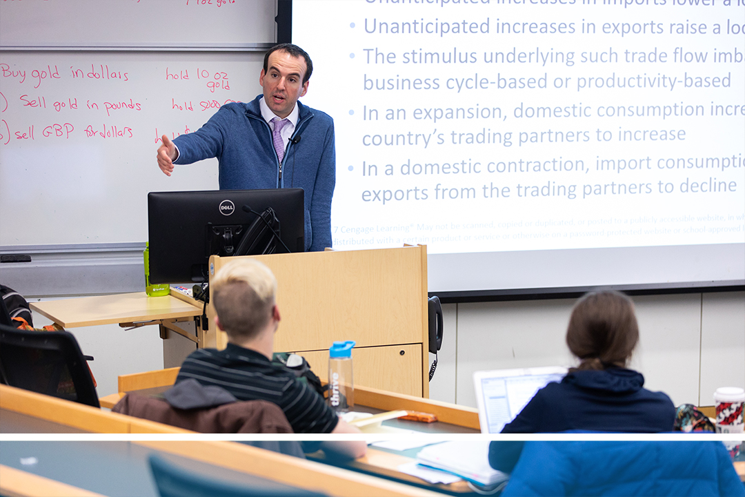 Professor Daniel Marcin lectures a class. Watch the video about the Department of Economics to find out more.
