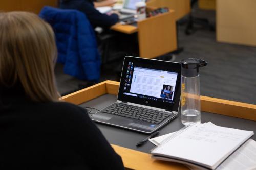 A student looking at her laptop