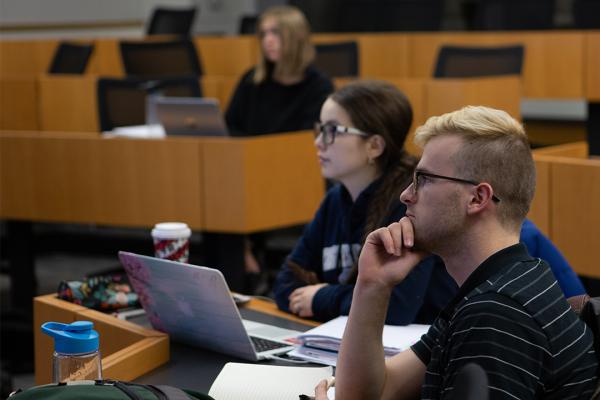 students listening in an MA in Applied Economics class