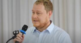 professor speaking at a podium